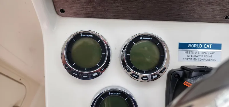 Slide: The Image of Control panel of 2016 World Cat 2780 Glacier Bay Edition with Suzuki gauges. - 25