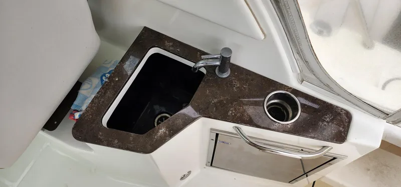 Slide: The Image of 2016 World Cat 2780 Glacier Bay Edition boat sink and countertop detail. - 32