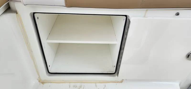 Slide: The Image of Open storage compartment on 2016 World Cat 2780 Glacier Bay Edition boat. - 33