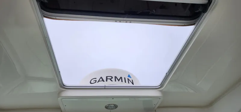 Slide: The Image of 2016 World Cat 2780 Glacier Bay Edition boat with Garmin radar through open hatch. - 39