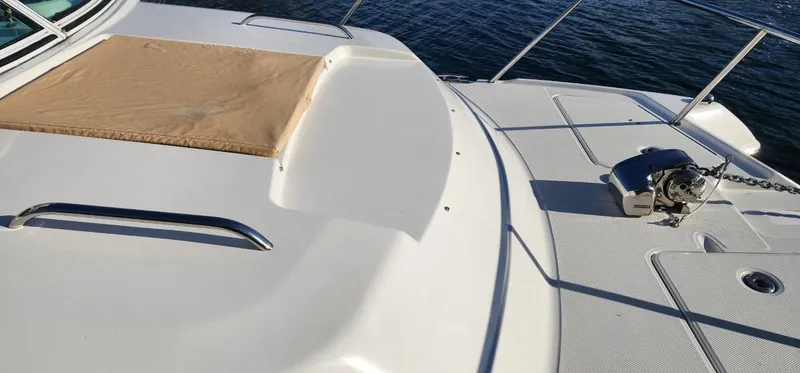 Slide: The Image of 2016 World Cat 2780 Glacier Bay Edition boat deck with anchor, on calm water. - 6