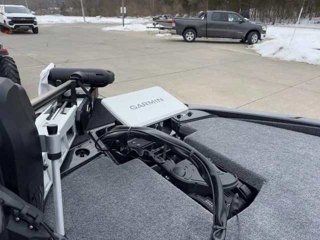 Slide: The Image of 2025 Phoenix 921 ELITE boat with Garmin equipment, parked on snowy pavement. - 11