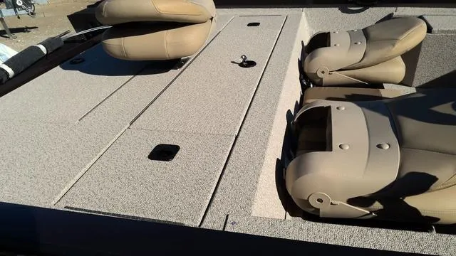 Slide: The Image of 2025 G3 Sportsman 1610 boat interior with beige seating and storage compartments. - 13