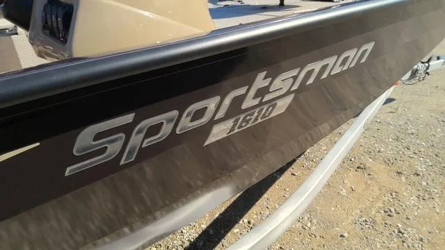 Slide: The Image of 2025 G3 Sportsman 1610 boat, close-up of logo on hull, outdoors. - 14