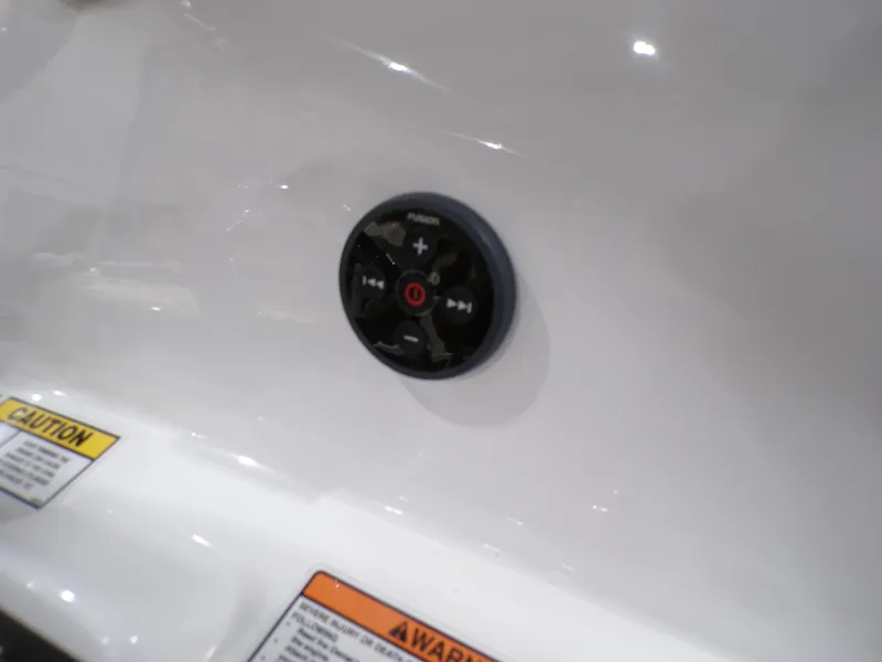 Slide: The Image of 2024 NauticStar 231 Hybrid control panel with caution labels. - 17