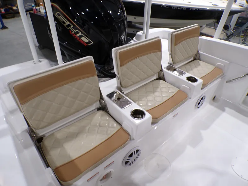 Slide: The Image of 2024 NauticStar 231 Hybrid boat seats with beige and white diamond-pattern upholstery. - 30