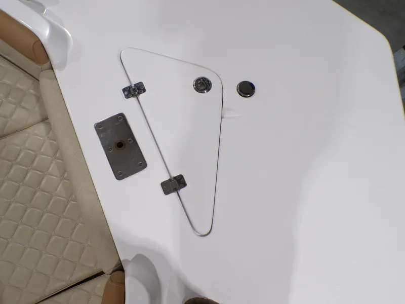 Slide: The Image of 2024 NauticStar 231 Hybrid boat deck with storage hatch and seating. - 35