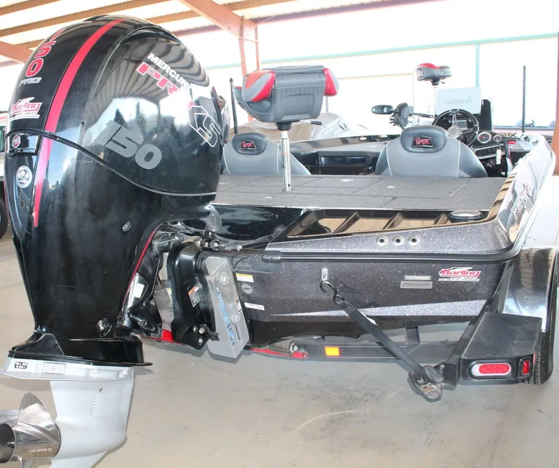 Slide: The Image of 2020 Ranger Z185 boat with Mercury 150 Pro XS engine in a garage. - 21