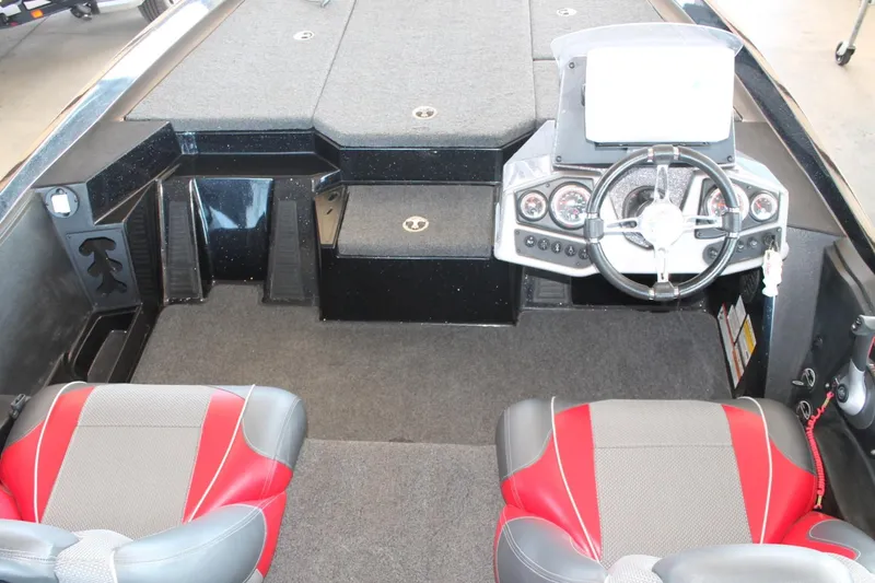 Slide: The Image of 2020 Ranger Z185 boat interior with steering wheel and red-gray seats. - 22