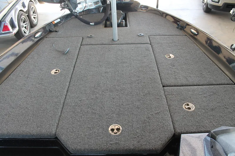 Slide: The Image of 2020 Ranger Z185 boat deck with carpeted surface and storage compartments. - 23