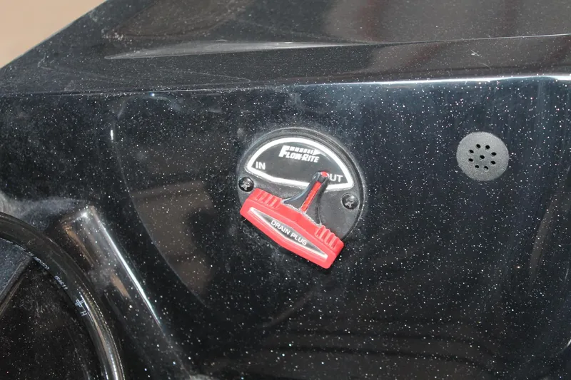 Slide: The Image of Control panel of a 2020 Ranger Z185 boat with Flow-Rite valve and drain plug. - 33