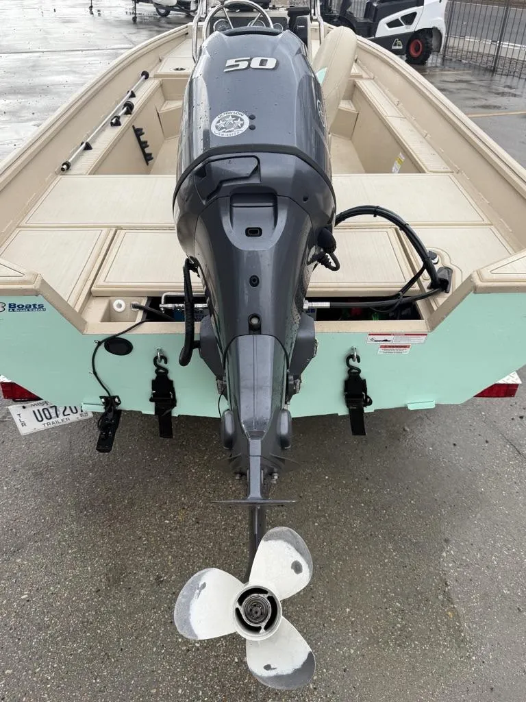 Slide: The Image of 2021 G3 17 BAY boat with 50 HP outboard motor, rear view. - 4