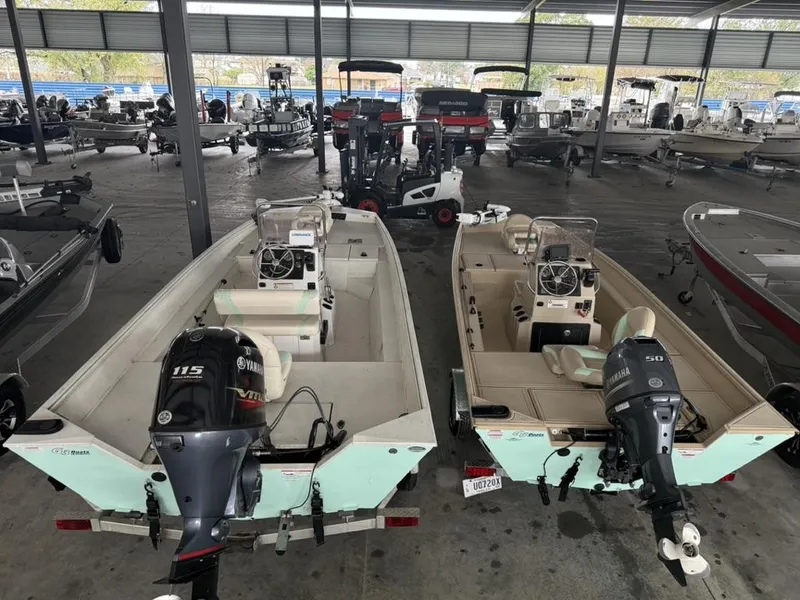 Slide: The Image of Two G3 17 BAY boats from 2021 with Yamaha outboard motors in a covered storage area. - 5
