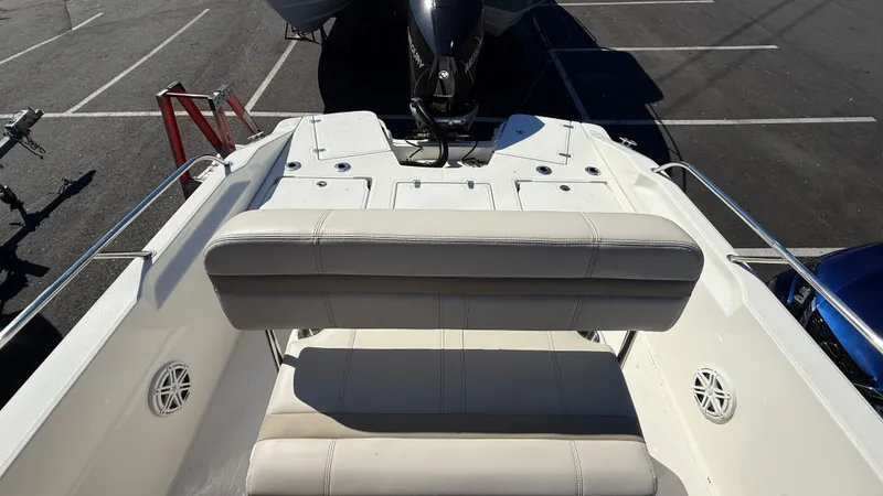 Slide: The Image of 2025 Boston Whaler 250 Dauntless boat interior with seating and engine view. - 5