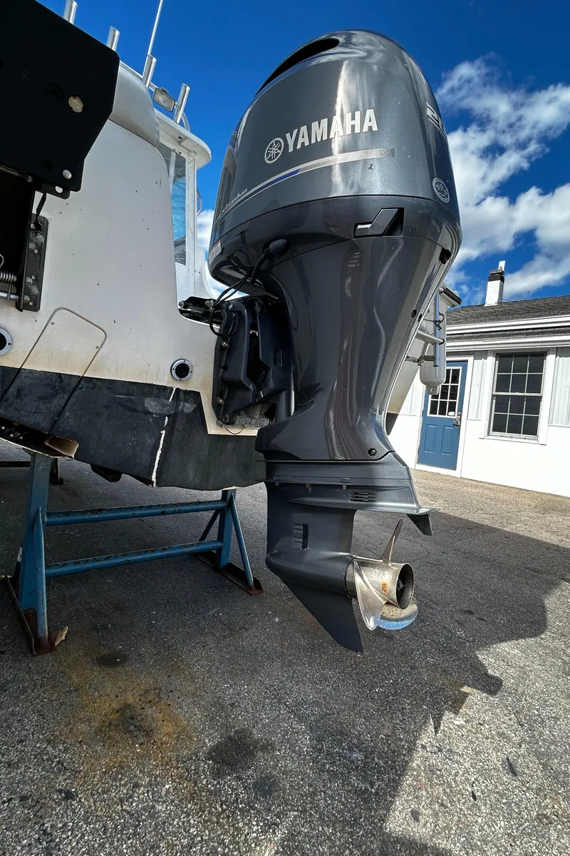 Slide: The Image of 2014 Steiger Craft 21 DV MIAMI with Yamaha outboard motor, parked on a stand. - 19