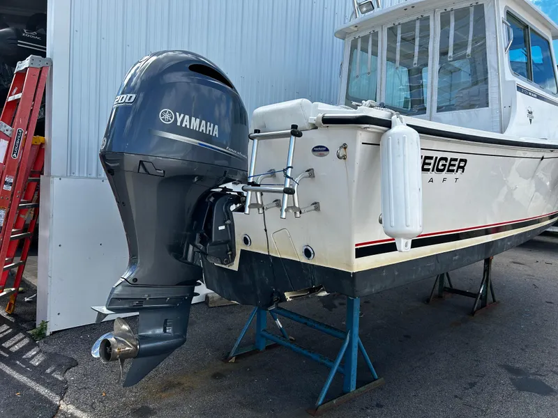 Slide: The Image of 2014 Steiger Craft 21 DV Miami boat with Yamaha outboard motor on stands. - 5