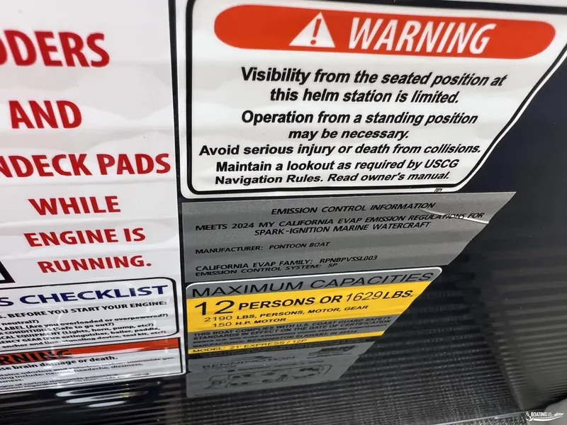 Slide: The Image of Warning and capacity labels on a 2025 Bennington M22 boat. - 12
