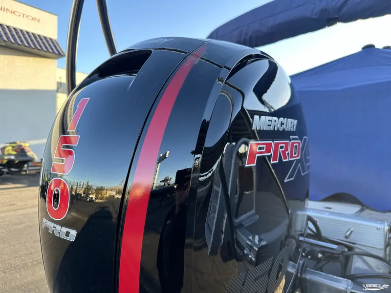 Slide: The Image of Mercury Pro XS 150 engine on 2025 Bennington M22 boat, close-up view. - 14