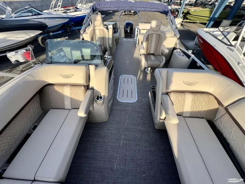 Slide: The Image of Luxurious interior of 2025 Bennington M22 pontoon boat with plush seating and modern design. - 2