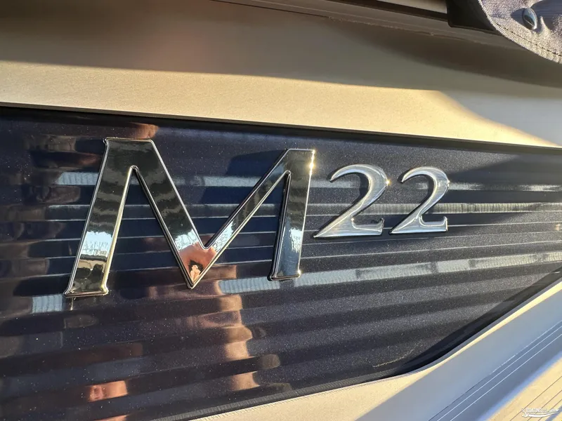 Slide: The Image of 2025 Bennington M22 boat logo in metallic finish. - 6