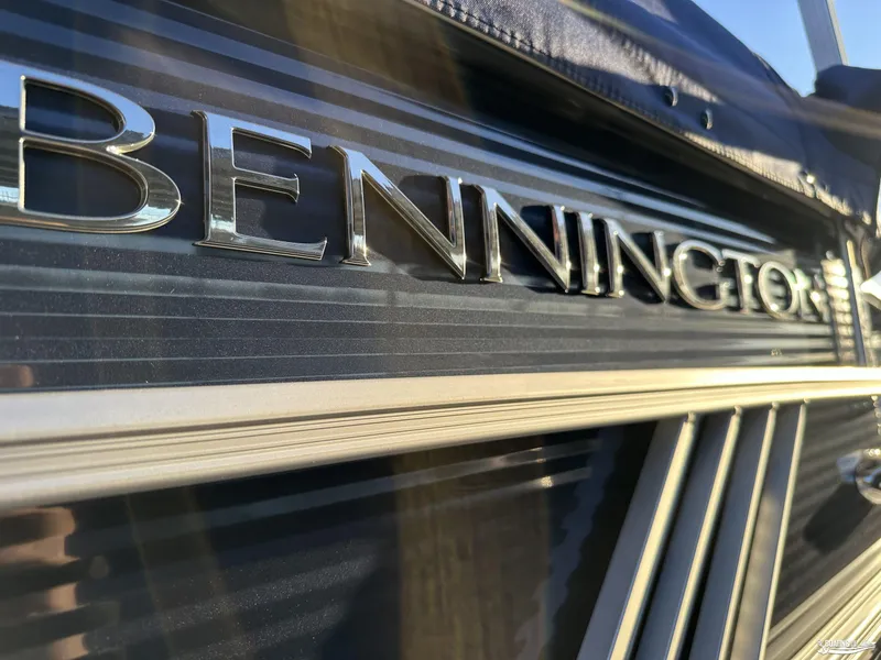 Slide: The Image of Close-up of 2025 Bennington M22 boat logo with sleek metallic finish. - 7