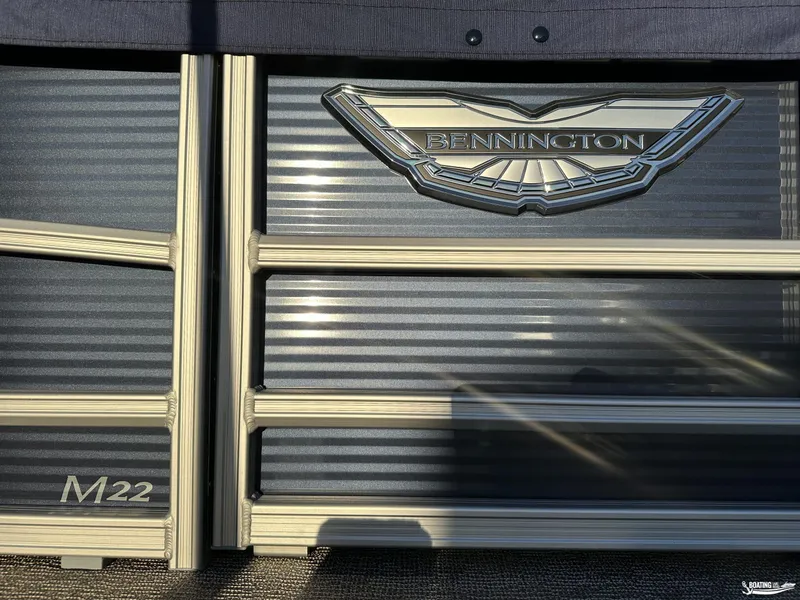 Slide: The Image of 2025 Bennington M22 boat logo and model detail in sunlight. - 8