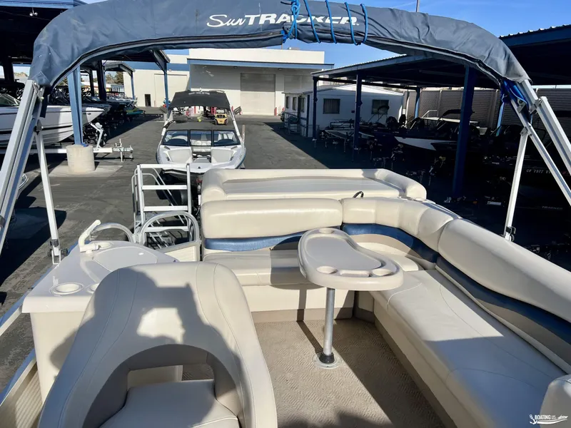 Slide: The Image of 2005 Sun Tracker PARTY BARGE 25 pontoon boat with seating and canopy in a marina. - 15