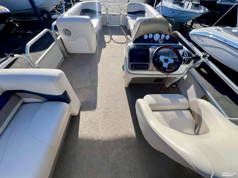 Slide: The Image of 2005 Sun Tracker PARTY BARGE 25 interior with steering console and seating. - 17