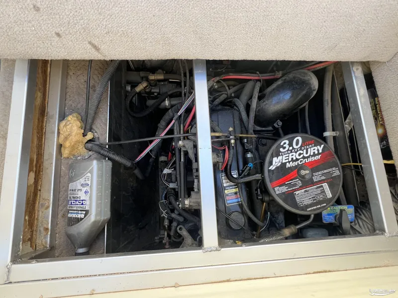 Slide: The Image of 2005 Sun Tracker PARTY BARGE 25 engine compartment with Mercury MerCruiser 3.0L motor. - 19