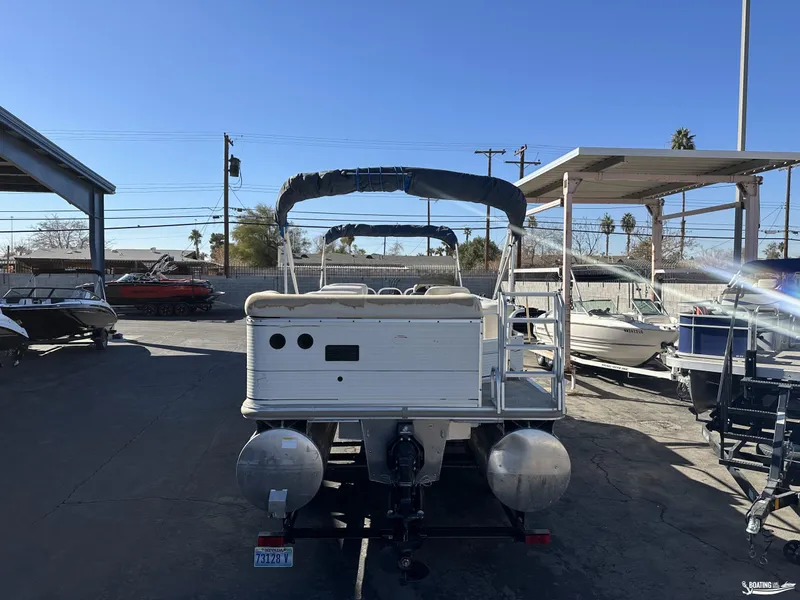 Slide: The Image of 2005 Sun Tracker PARTY BARGE 25 pontoon boat in a marina setting. - 20