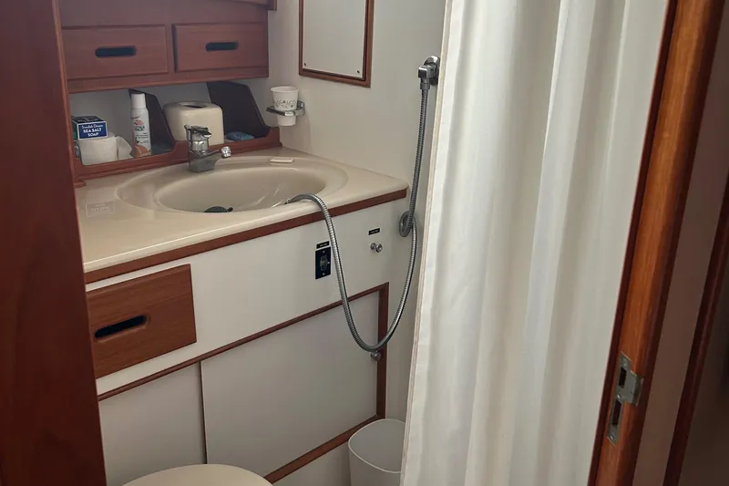 Slide: The Image of Bathroom interior of 1999 Grand Banks Classic yacht with sink and shower. - 21