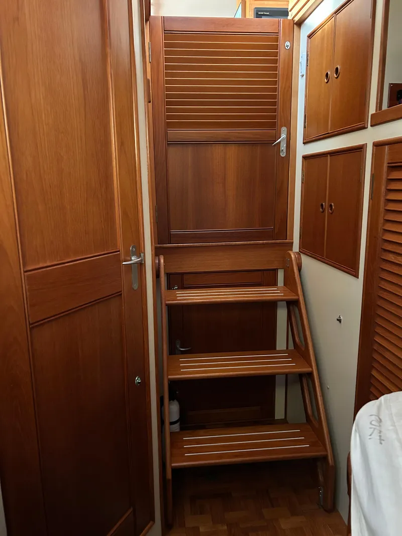 Slide: The Image of Wooden interior stairs on a 1999 Grand Banks Classic boat. - 22
