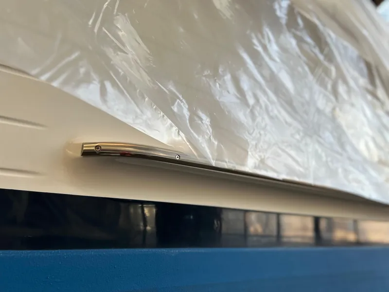 Slide: The Image of Close-up of a 1999 Grand Banks Classic boat detail with protective covering. - 37