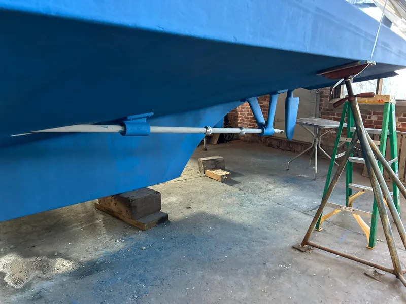 Slide: The Image of 1999 Grand Banks Classic boat hull with propeller and rudder in dry dock. - 38