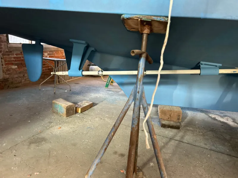 Slide: The Image of 1999 Grand Banks Classic boat hull on stands in a workshop. - 39