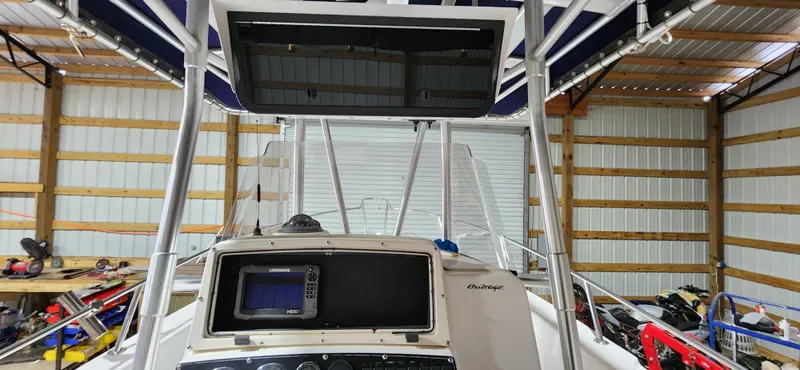 Slide: The Image of 1999 Boston Whaler 23 Outrage boat console in a storage facility. - 12