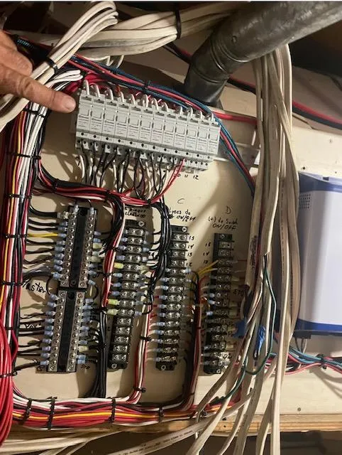 Slide: The Image of Electrical panel with organized wiring in a 1990 Striker Sportfish boat. - 20