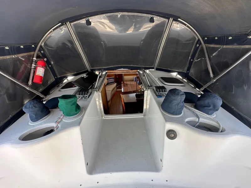 Slide: The Image of 2001 Hunter 380 sailboat cockpit with covered instruments and visible cabin entrance. - 20