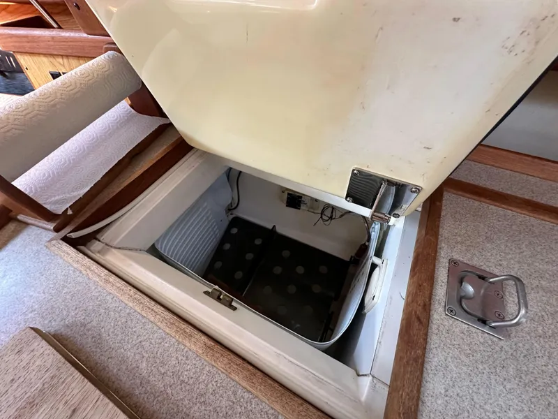 Slide: The Image of Open storage compartment in a 2001 Hunter 380 boat interior. - 27