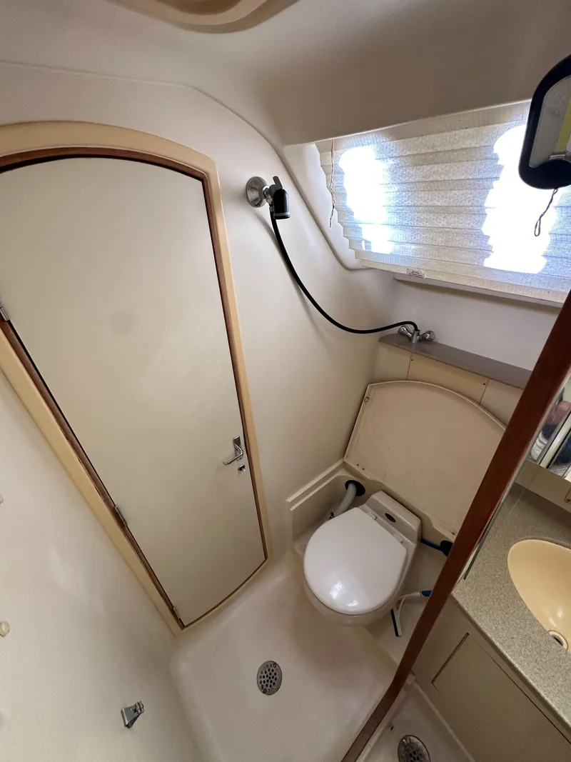 Slide: The Image of Compact bathroom in 2001 Hunter 380 sailboat with shower and toilet. - 32