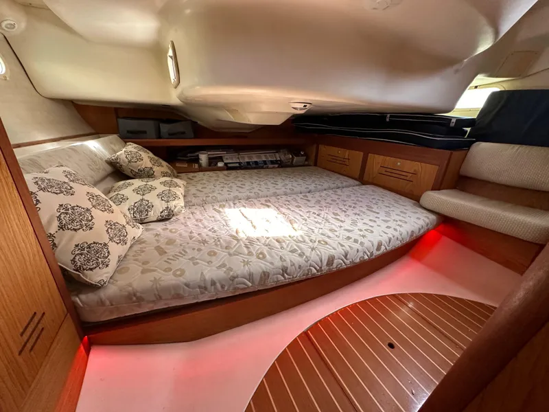 Slide: The Image of Cozy cabin interior of 2001 Hunter 380 yacht with double bed and ambient lighting. - 48