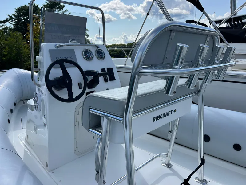 Slide: The Image of 2022 Ribcraft 5.85 boat interior with steering console and seating. - 8
