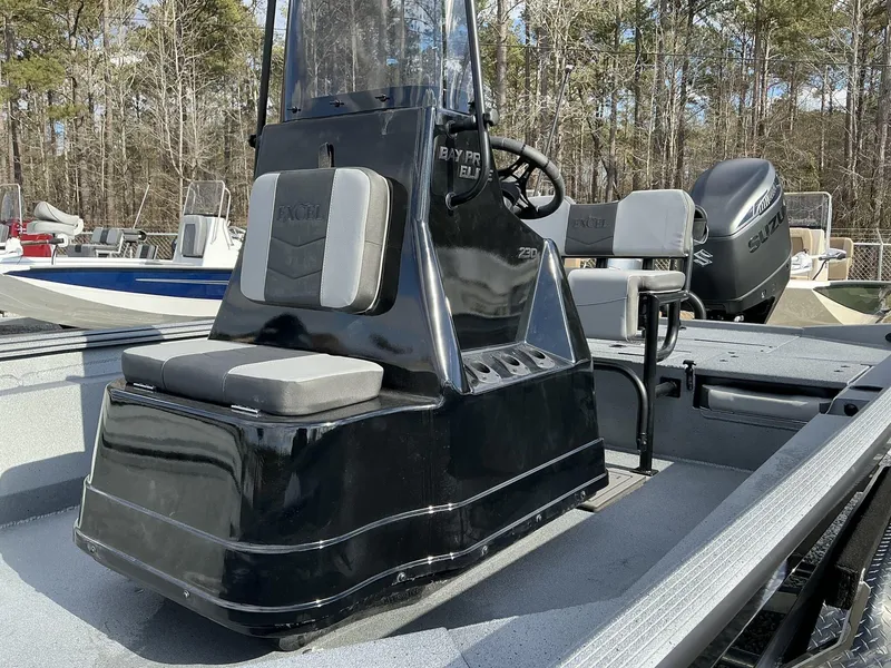 Slide: The Image of 2025 Excel New Bay Pro 230 SEADECK boat, featuring sleek design and modern seating. - 10