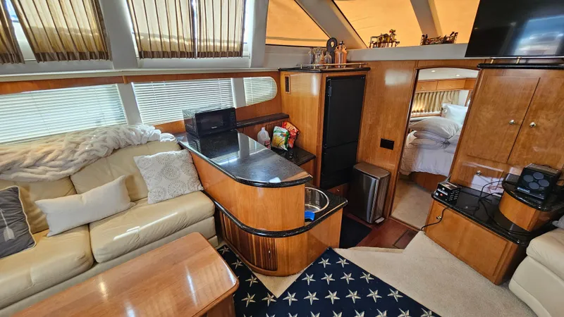 Slide: The Image of Luxurious interior of 2002 Carver 396 Motor Yacht with cozy seating and modern amenities. - 10