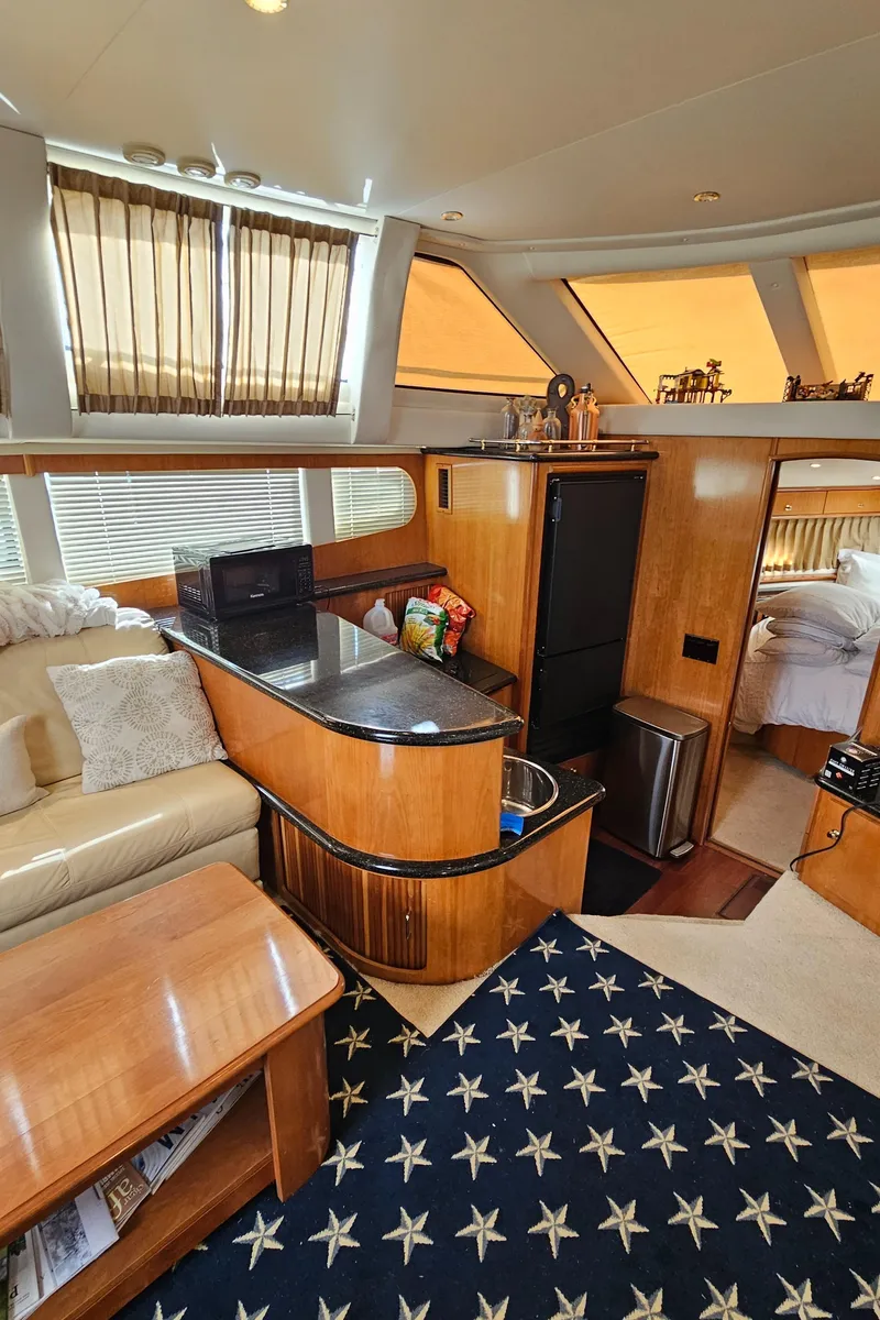 Slide: The Image of Luxurious interior of 2002 Carver 396 Motor Yacht with elegant furnishings and modern amenities. - 12