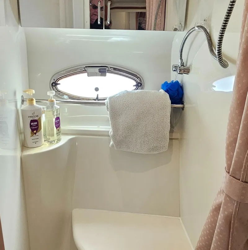 Slide: The Image of Bathroom of 2002 Carver 396 Motor Yacht with shower and toiletries. - 13
