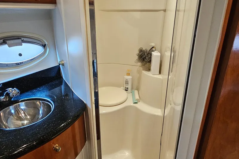 Slide: The Image of Bathroom interior of 2002 Carver 396 Motor Yacht with sink and shower. - 19