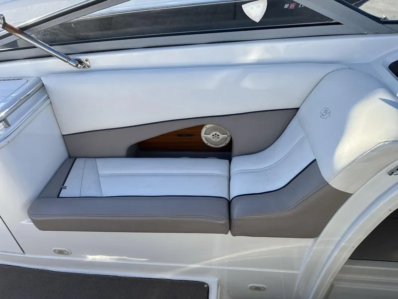 Slide: The Image of Interior seating of a 2000 Cobalt 293 boat, featuring white and gray upholstery. - 13