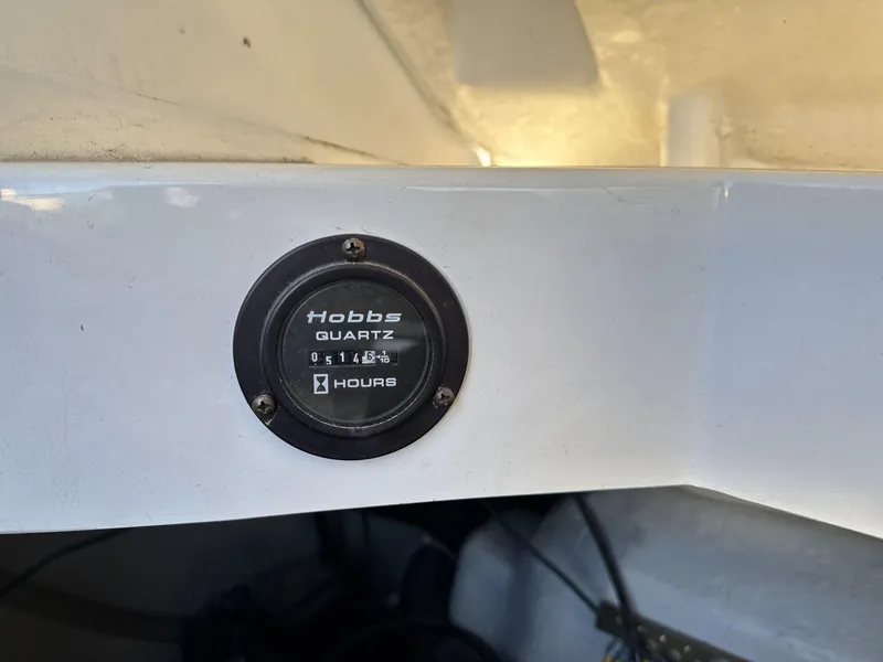 Slide: The Image of Hobbs Quartz hour meter on a 2000 Cobalt 293 boat dashboard. - 20