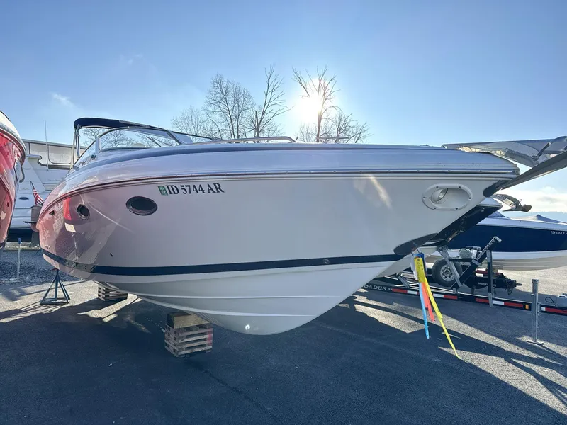 Slide: The Image of 2000 Cobalt 293 boat on trailer, parked outdoors under clear sky. - 5